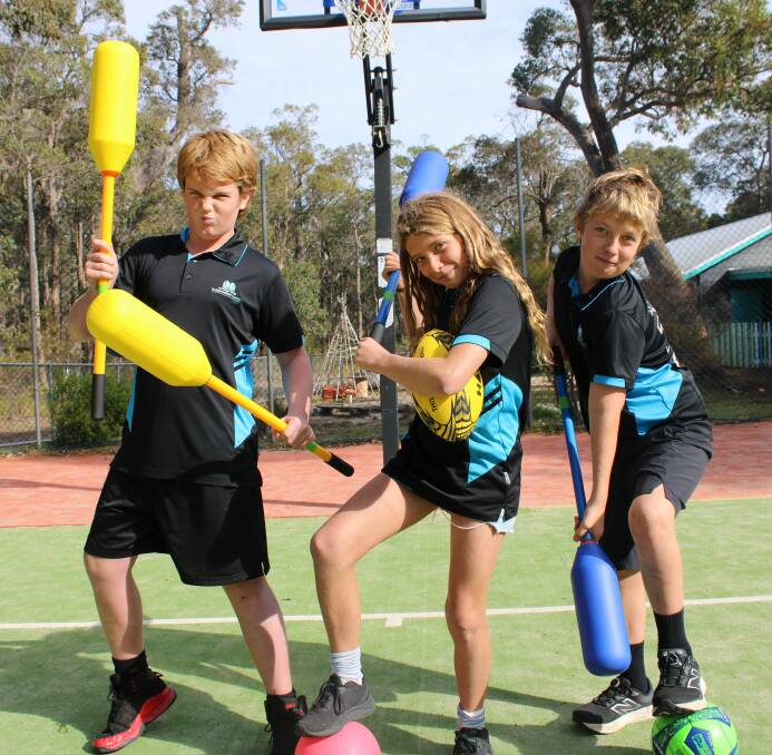 Year 6 students Felix Goddard, Leeuwin Firth and Gus Fleming with the new sports equipment. 