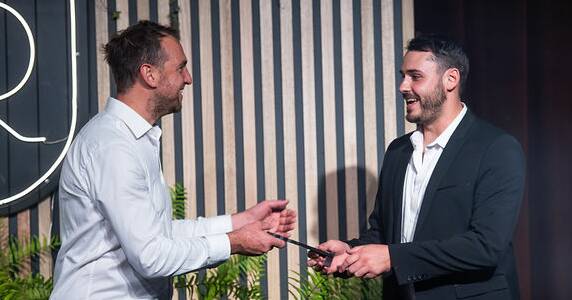 Margaret River Beer Co's head brewer Ryan Allan (right) collects one of the brewery's many awards. 